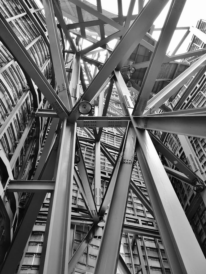 services-01 A detailed view of a complex steel framework showcasing modern industrial architecture.